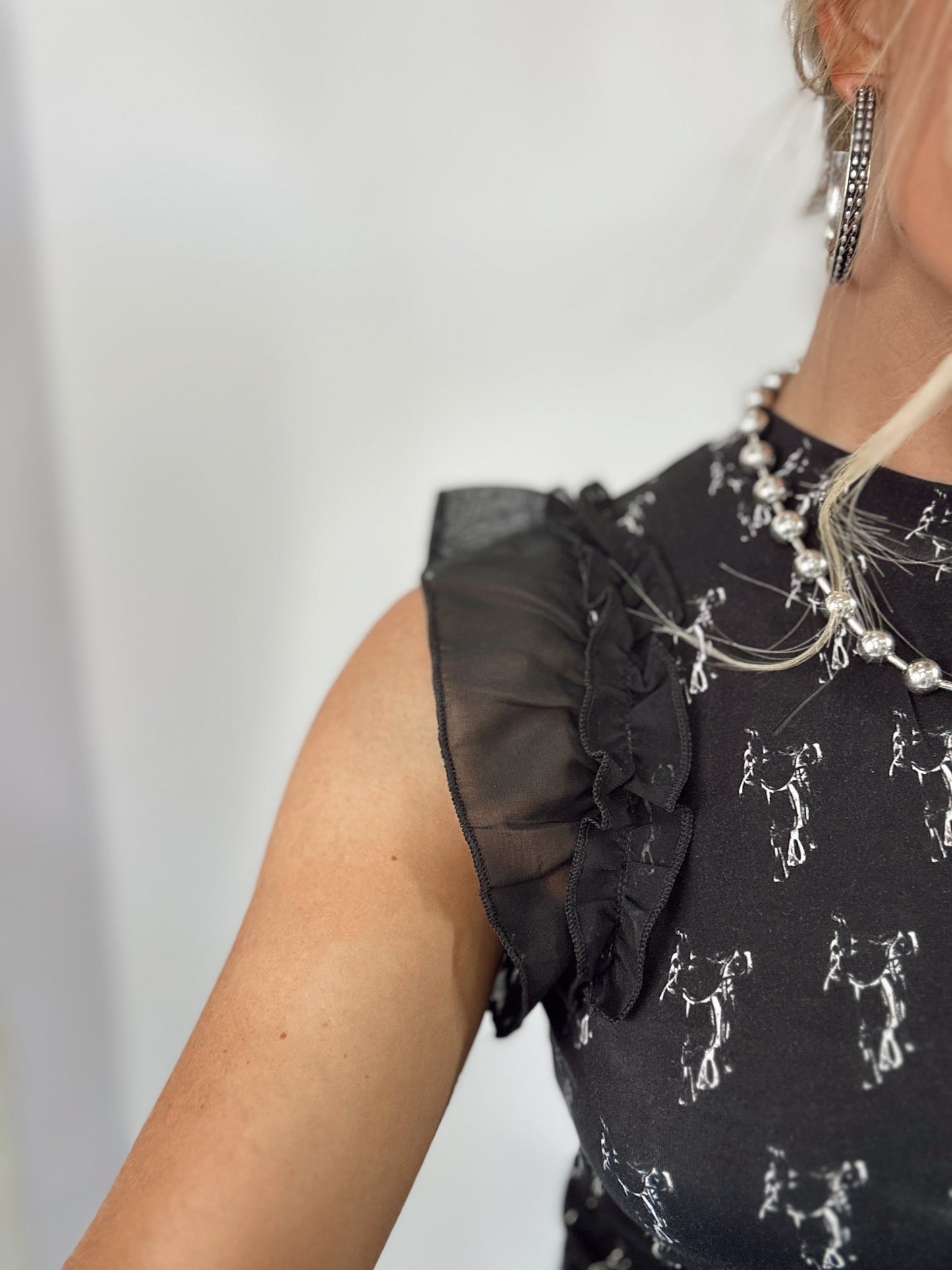 THE SADDLERY TOP